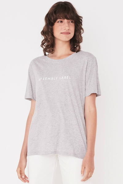 ASSEMBLY LABEL LOGO COTTON CREW TEE  The Assembly Label Logo Cotton Crew Tee is a classic slogan tee perfect for every day wear. The Logo Cotton Crew is the t-shirt version of the cult favourite Assembly Label Logo Fleece  The Assembly Label Logo Cotton Crew Tee features a relaxed silhouette and crew neckline, finishing with signature 'Assembly Label' screen print across the chest. 